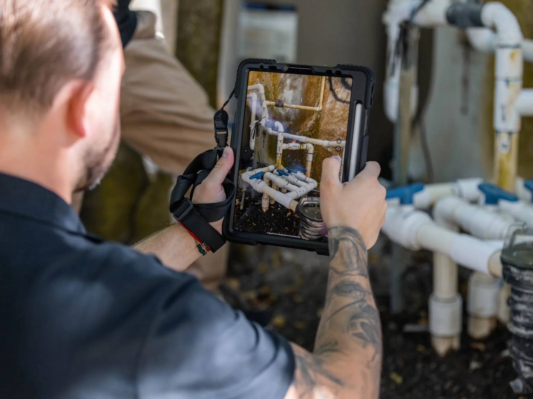 Trusted Watchers documenting a home system issue during a property visit